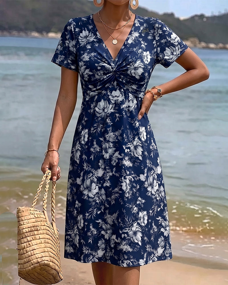 Mia — Robe fleurie avec décolleté en V et nœud twist