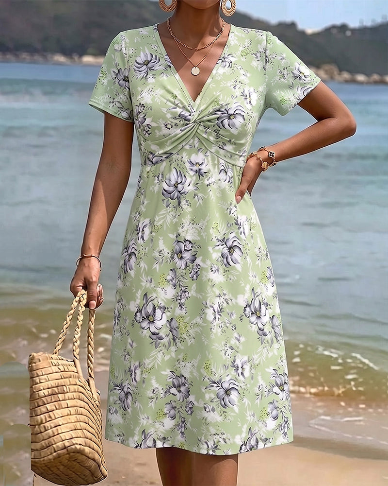 Mia — Robe fleurie avec décolleté en V et nœud twist