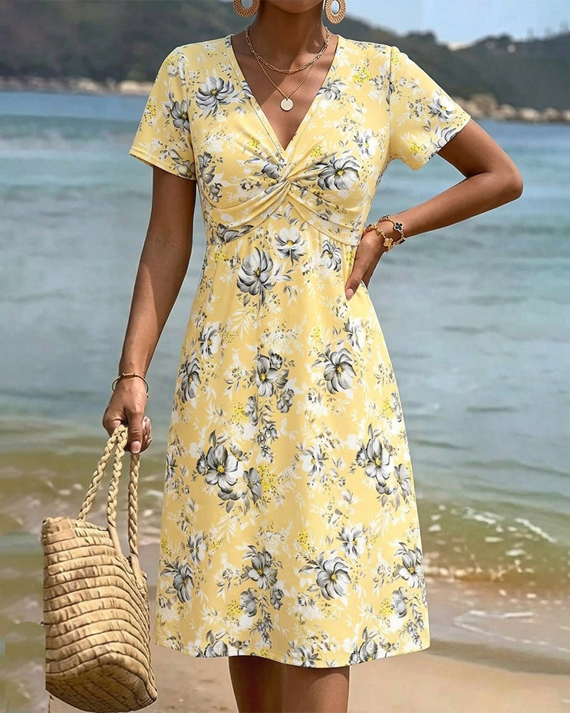 Mia — Robe fleurie avec décolleté en V et nœud twist